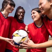 Equipe de foot féminine célébrant leur victoire 